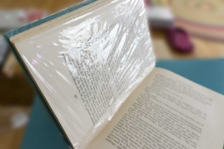 plastic wrap that book!